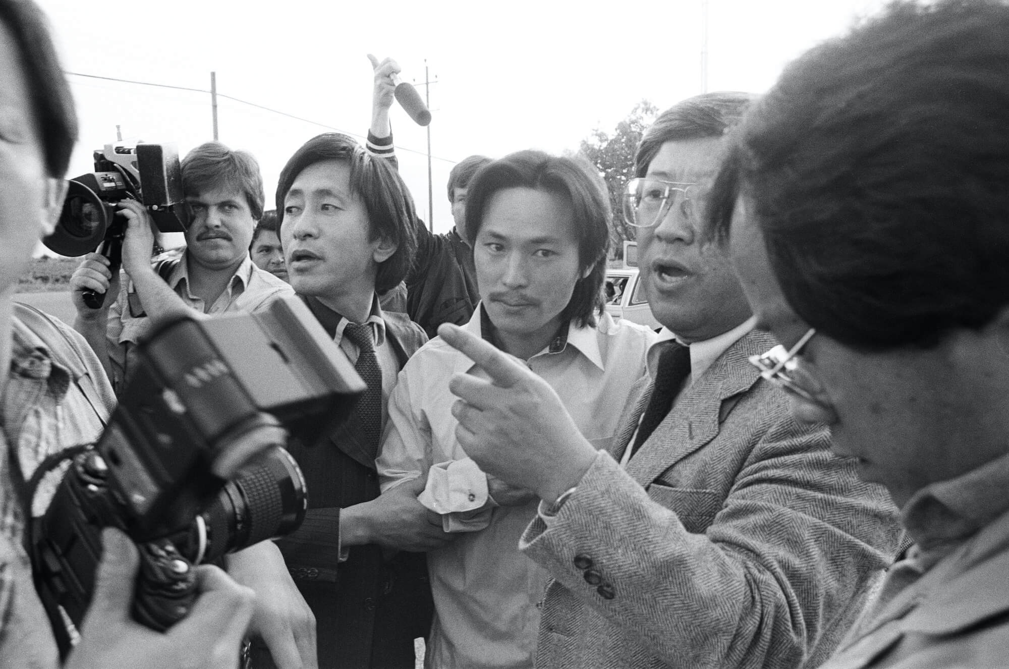 Free Chol Soo Lee movie still with a man surrounded by press.
